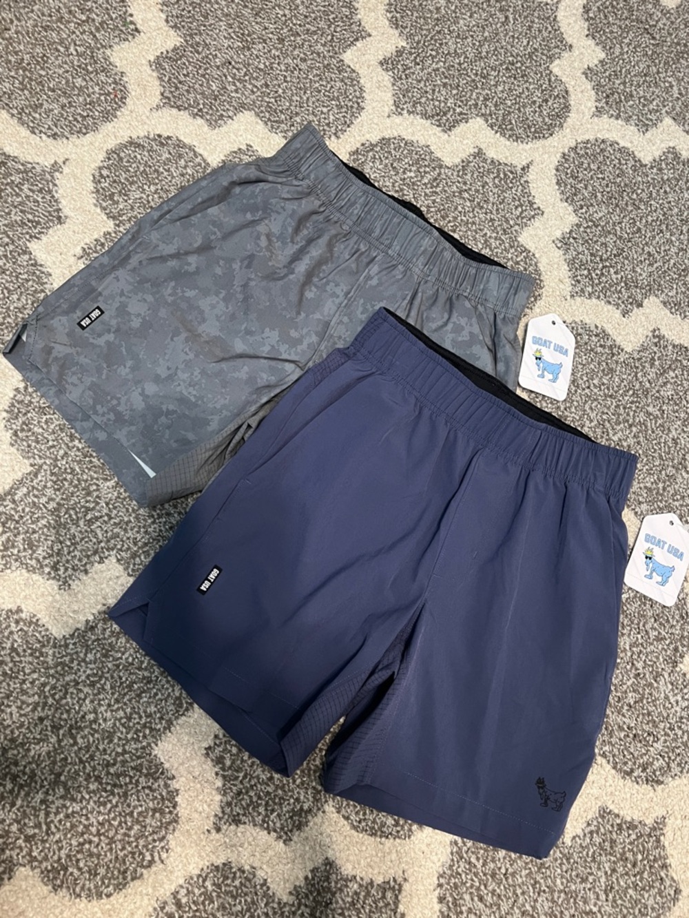 TWO pair of GOAT USA boys shorts, grey and blue, size Youth Medium NWT!
